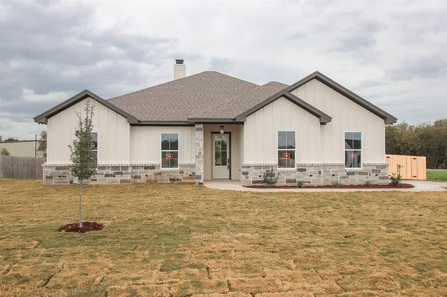 Front exterior of a new home in , Lorena, TX, highlighting curb appeal (Image 1).