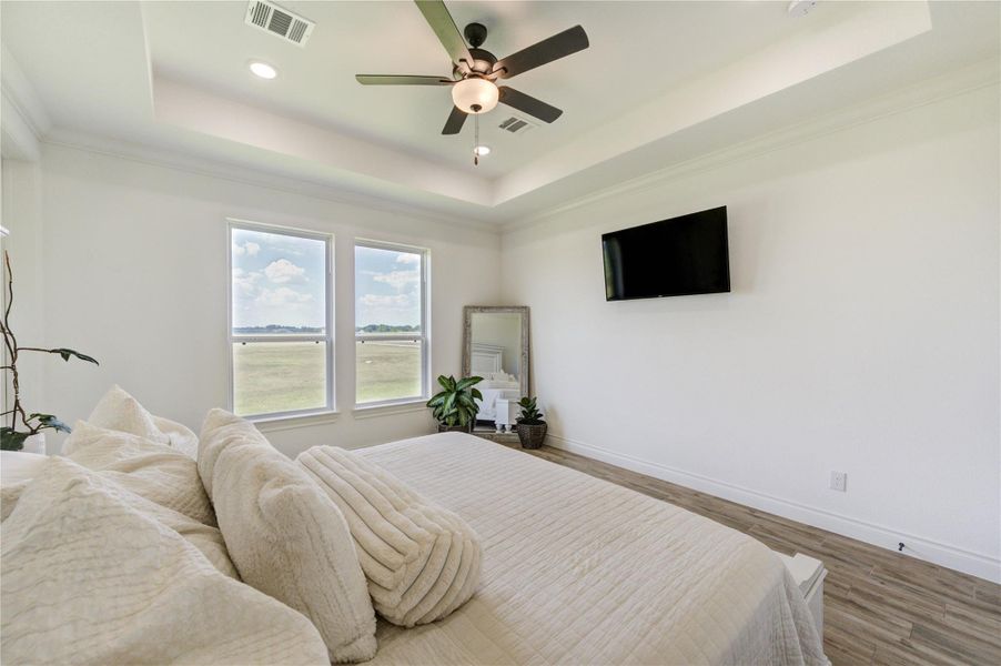 Primary bedroom offers serene outdoor views and plenty of room for relaxation