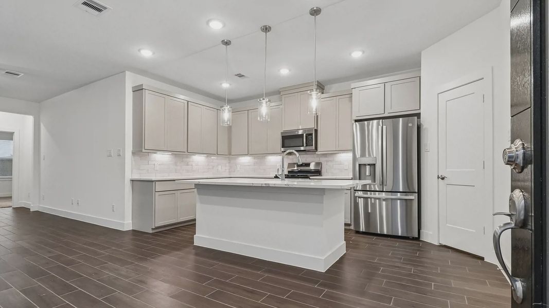 Furnished interior view inside a new home in Meridiana Townhomes, Manvel (Image 10).