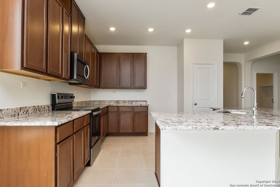 Furnished interior view inside a new home in Preserve at Culebra - Classic Collection, San Antonio (Image 3).