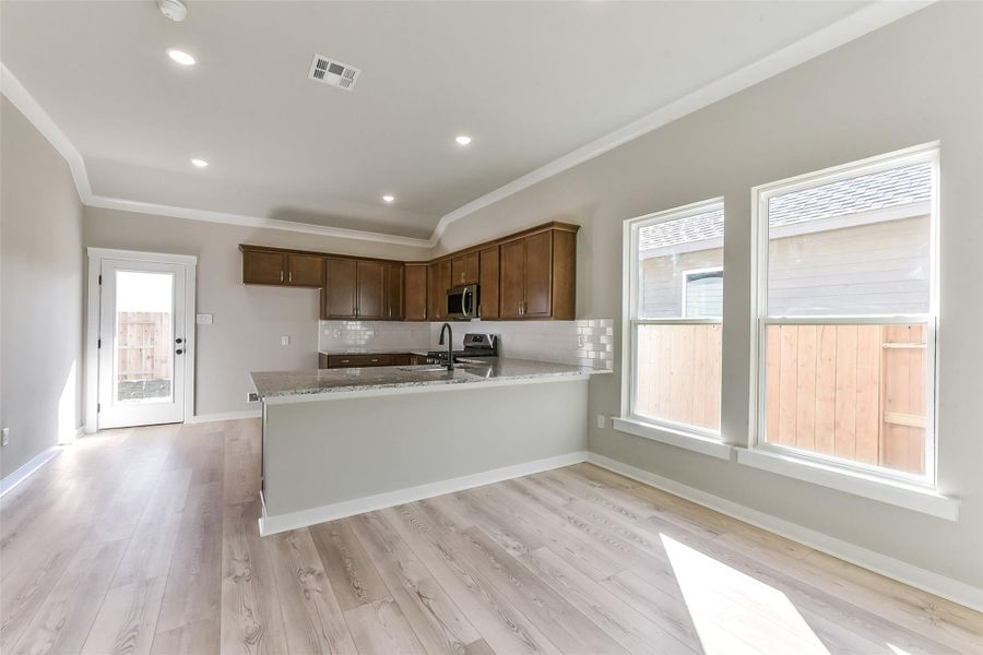 Furnished interior view inside a new home in Aldeana, Bonney (Image 9).