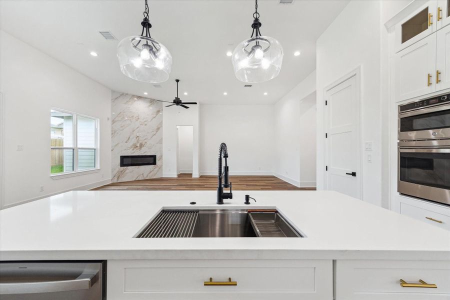 Experience the inviting view from the kitchen of this spacious, open floor plan. It's the perfect setting for entertaining guests. Experience the inviting view from the kitchen of this spacious, open floor plan. It's the perfect setting for entertaining guests.
