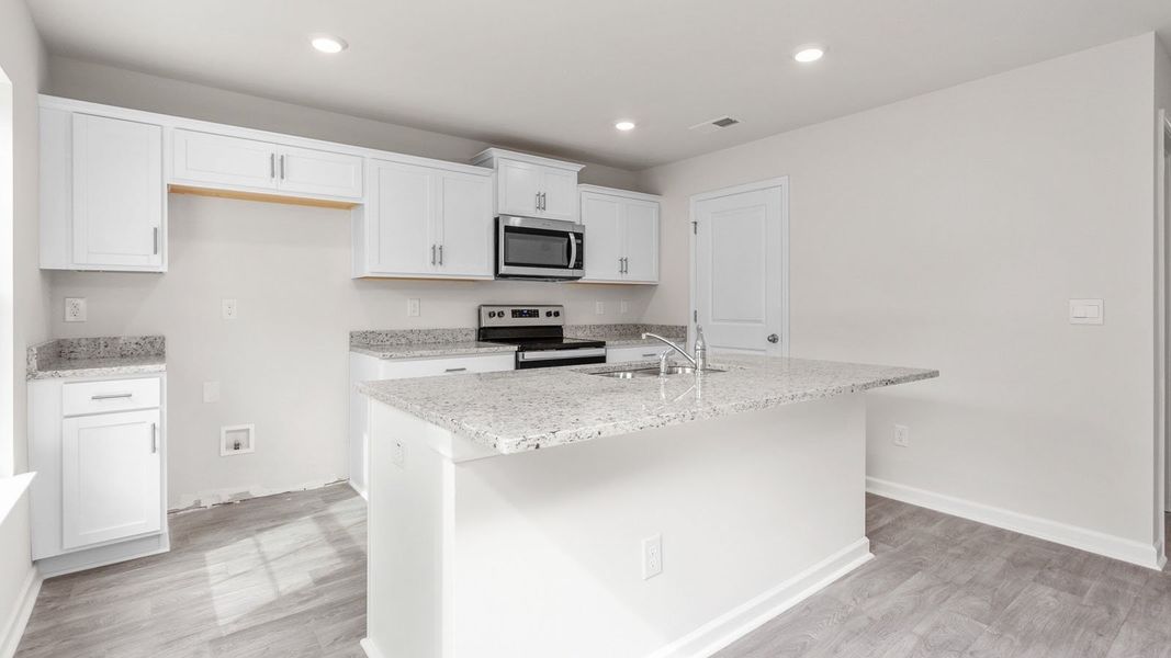 Representative furnished interior of a home built from the PENWELL by D.R. Horton in English Farm, Archdale (Image 5).