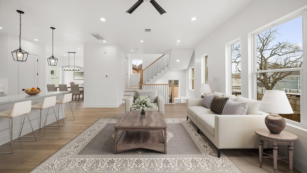 Virtually Staged: Complete with high ceilings, an abudance of light from many windows, recessed lights, ceiling fan, LVP floors and more.