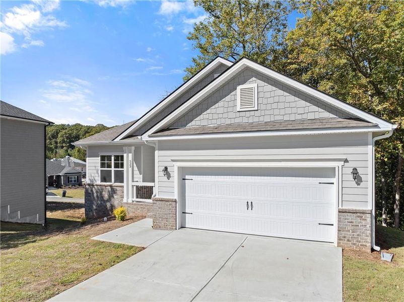 Front exterior of a new home in Habersham Meadows, Demorest, GA, highlighting curb appeal (Image 16).