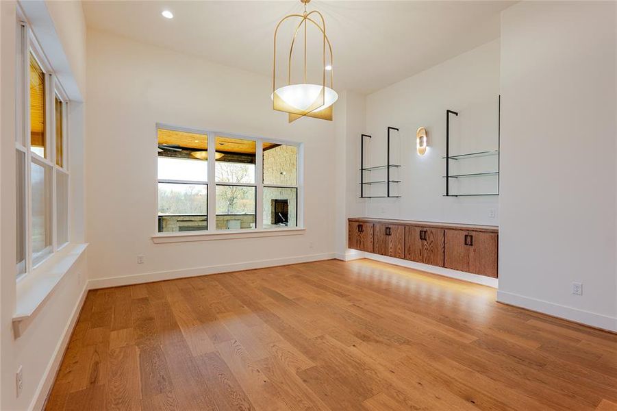 Unfurnished dining area featuring light wood-type flooring and recessed lighting