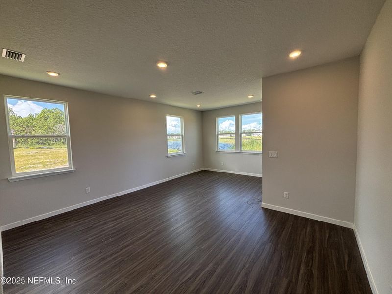 Spacious, unfurnished interior of a new home in The Cypress Series at Reserve East, Flagler Beach (Image 31).