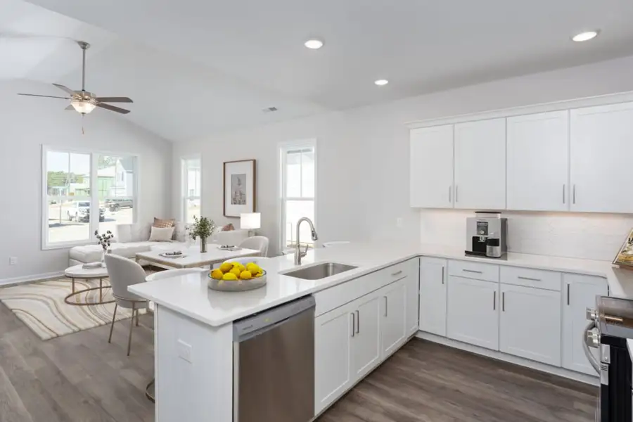 Representative furnished interior of a home built from the Palm by Stevens Fine Homes in River Hills, Shallotte (Image 4).