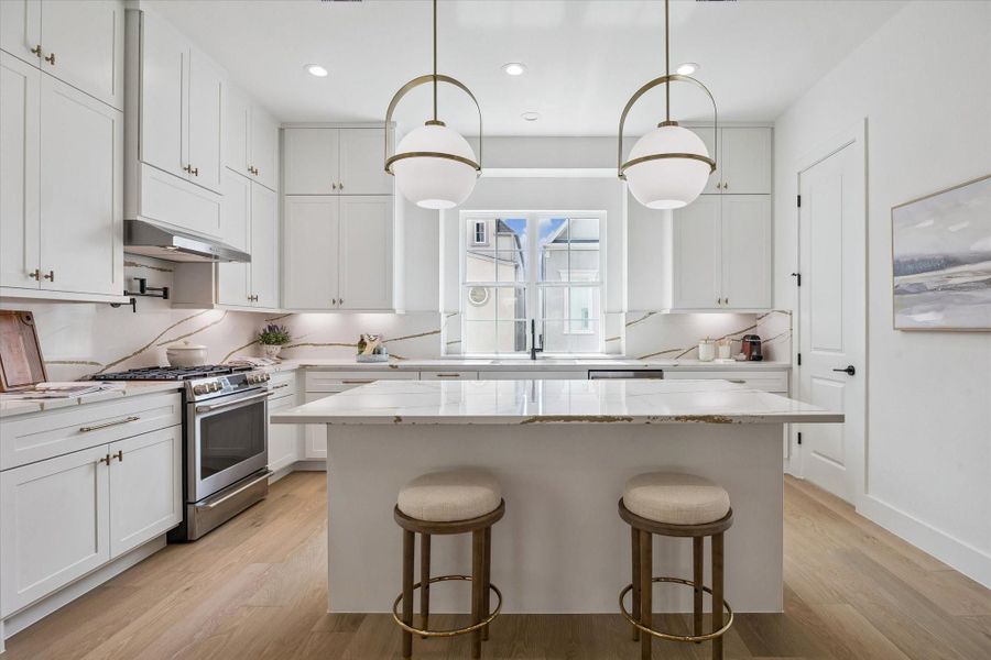 Shaker-style designer cabinets with soft-close drawers and stunning quartz countertops.