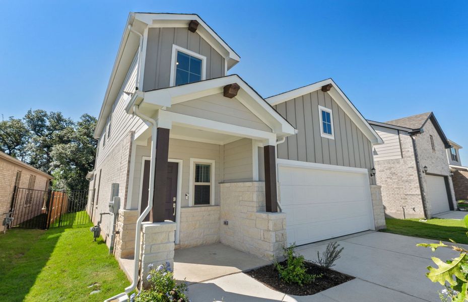 Front exterior of a new home in Saddleback at Santa Rita Ranch, Liberty Hill, TX, highlighting curb appeal (Image 19).