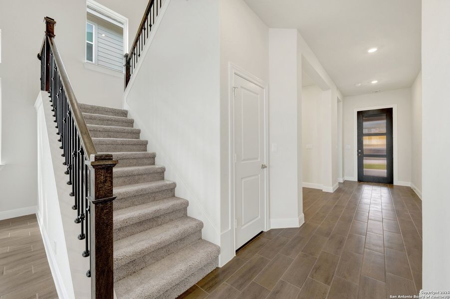 Spacious, unfurnished interior of a new home in Windsong - Reserve Series, Boerne (Image 37).