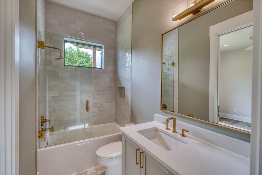 Full bath featuring bathing tub / shower combination, toilet, and vanity