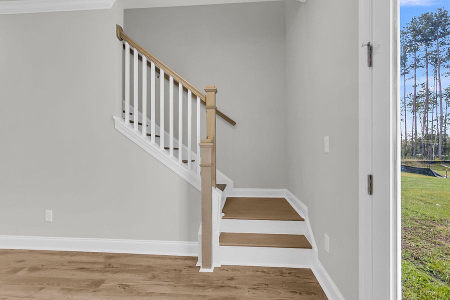 Spacious, unfurnished interior of a new home in Tidewater at Lakes of Cane Bay, Summerville (Image 23).