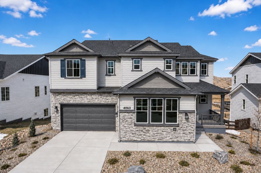 Front exterior of a new home in Macanta, Castle Rock, CO, highlighting curb appeal (Image 1). Front exterior of a new home in Macanta, Castle Rock, CO, highlighting curb appeal (Image 1).