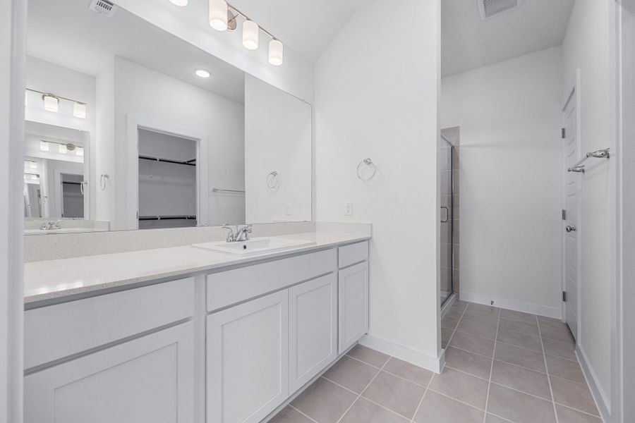 Primary Bath in the Cypress home plan by Trophy Signature Homes - REPRESENTATIVE PHOTO