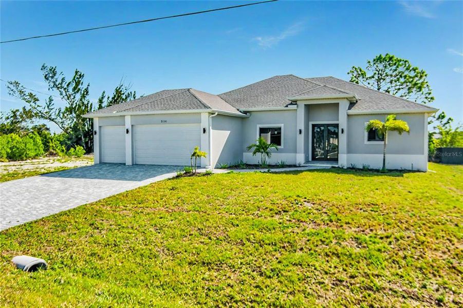 Front exterior of a new home in , Cape Coral, FL, highlighting curb appeal (Image 23). Front exterior of a new home in , Cape Coral, FL, highlighting curb appeal (Image 23).