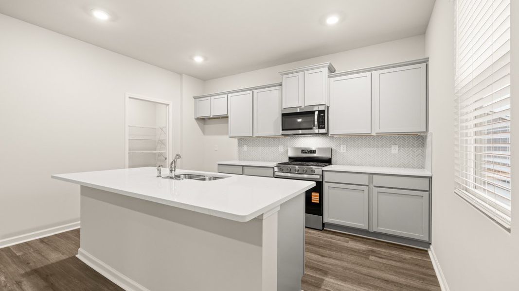 Representative furnished interior of a home built from the Galen by D.R. Horton in Champion's Run, Lithonia (Image 5).