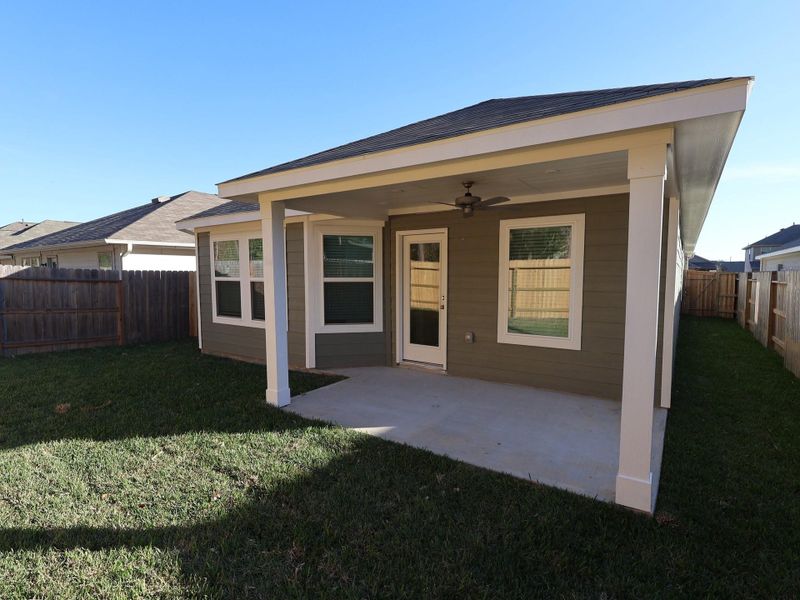 Exterior details and patio area of a home in Pinewood at Grand Texas, New Caney (Image 3).