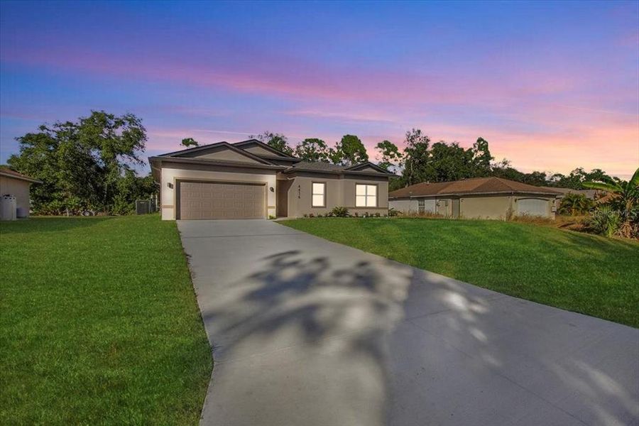 Front exterior of a new home in , North Port, FL, highlighting curb appeal (Image 23).