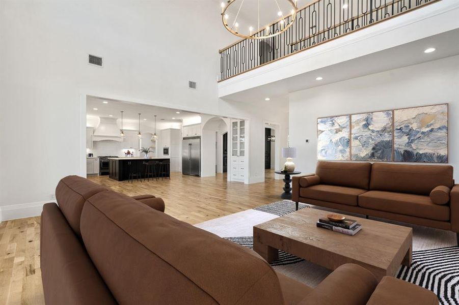 Looking back towards the kitchen; the bannister is such a special custom feature. *Virtually staged.