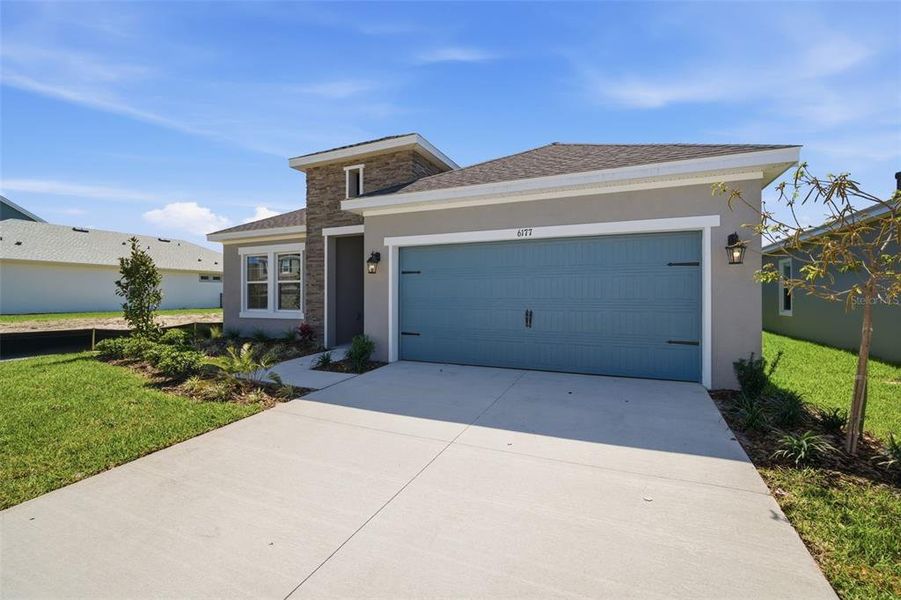 Front exterior of a new home in Waterset, Apollo Beach, FL, highlighting curb appeal (Image 1). Front exterior of a new home in Waterset, Apollo Beach, FL, highlighting curb appeal (Image 1).