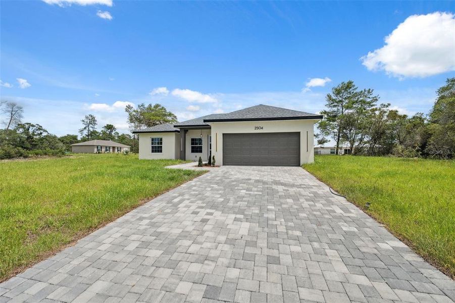 Front exterior of a new home in , Ocala, FL, highlighting curb appeal (Image 27).