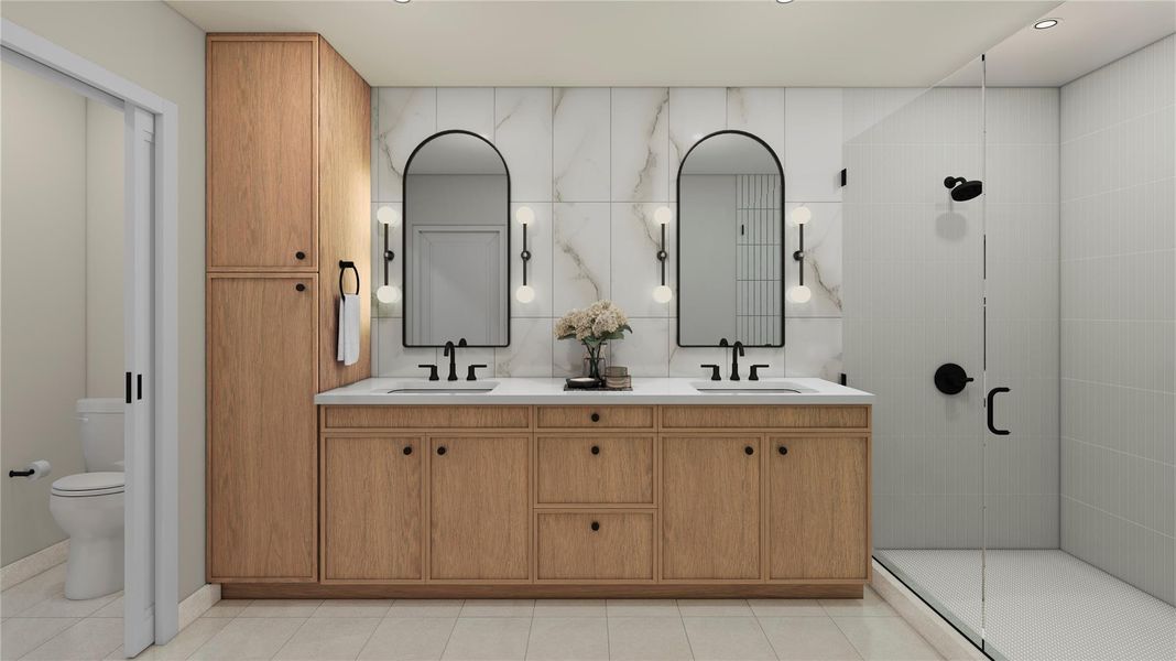 Bathroom featuring double vanity, a shower stall, and tile walls