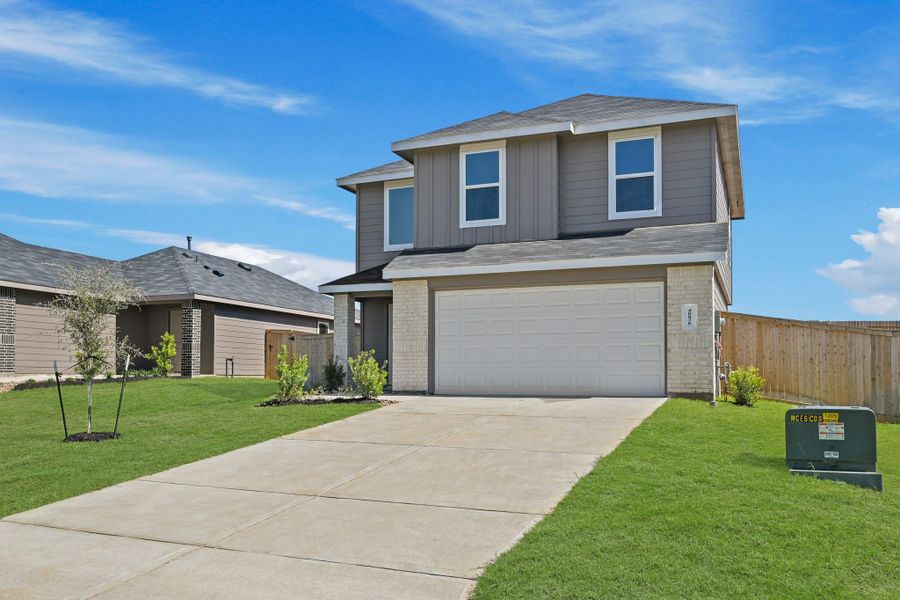 Front exterior of a new home in Mill Creek, Magnolia, TX, highlighting curb appeal (Image 5).