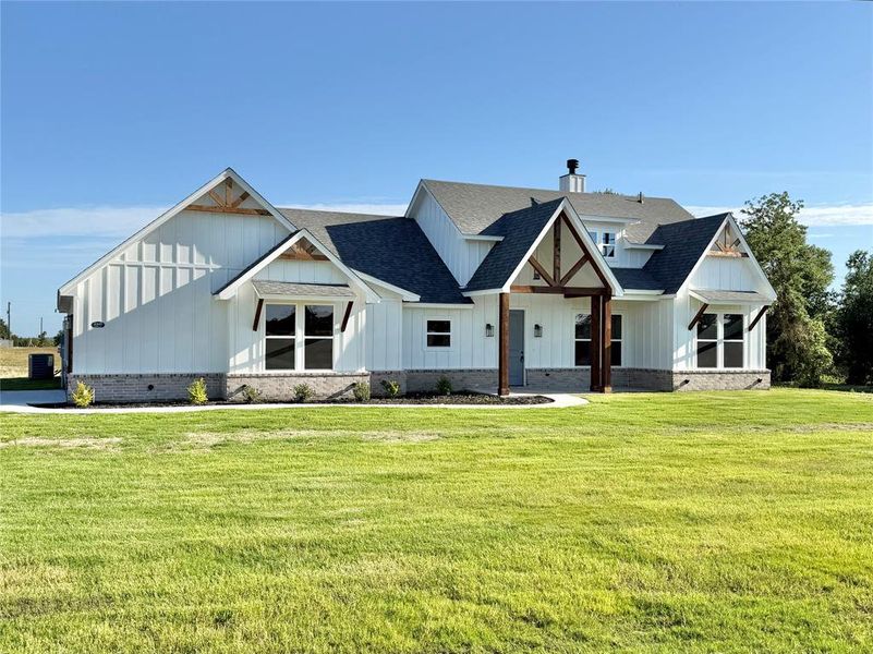 Front exterior of a new home in , Weatherford, TX, highlighting curb appeal (Image 12).