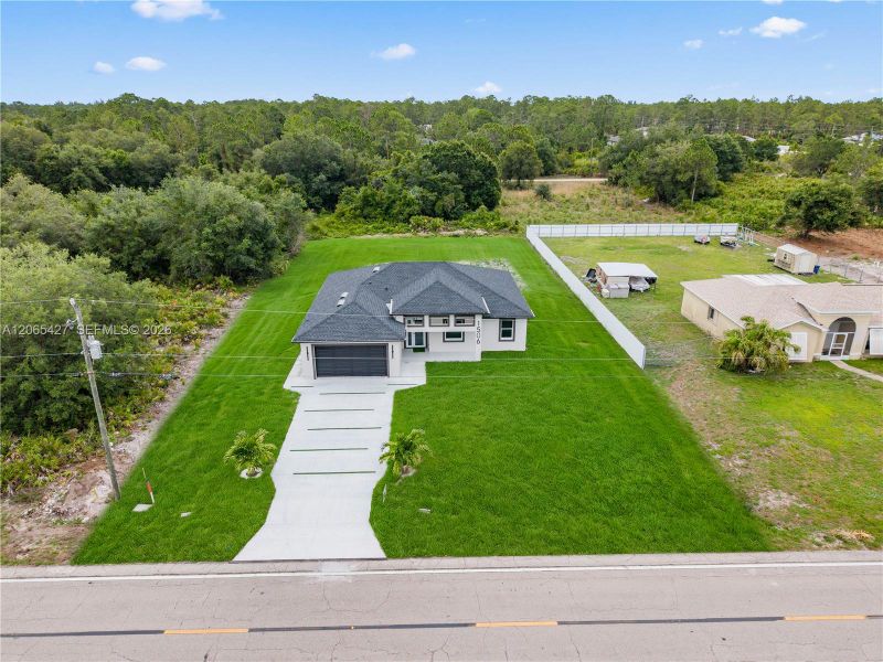 Front exterior of a new home in , Lehigh Acres, FL, highlighting curb appeal (Image 19). Front exterior of a new home in , Lehigh Acres, FL, highlighting curb appeal (Image 19).