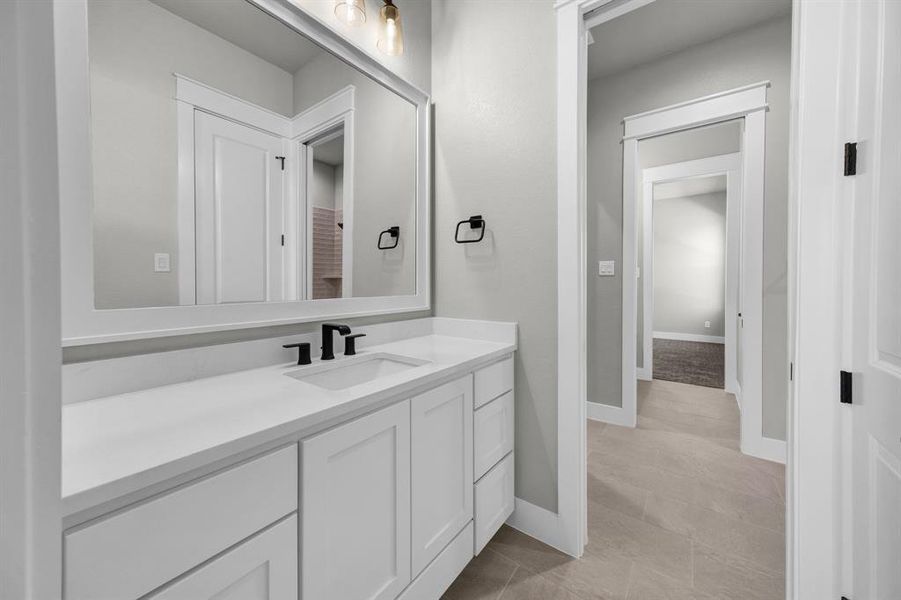 Jack and Jill Bathroom featuring tile flooring and vanity