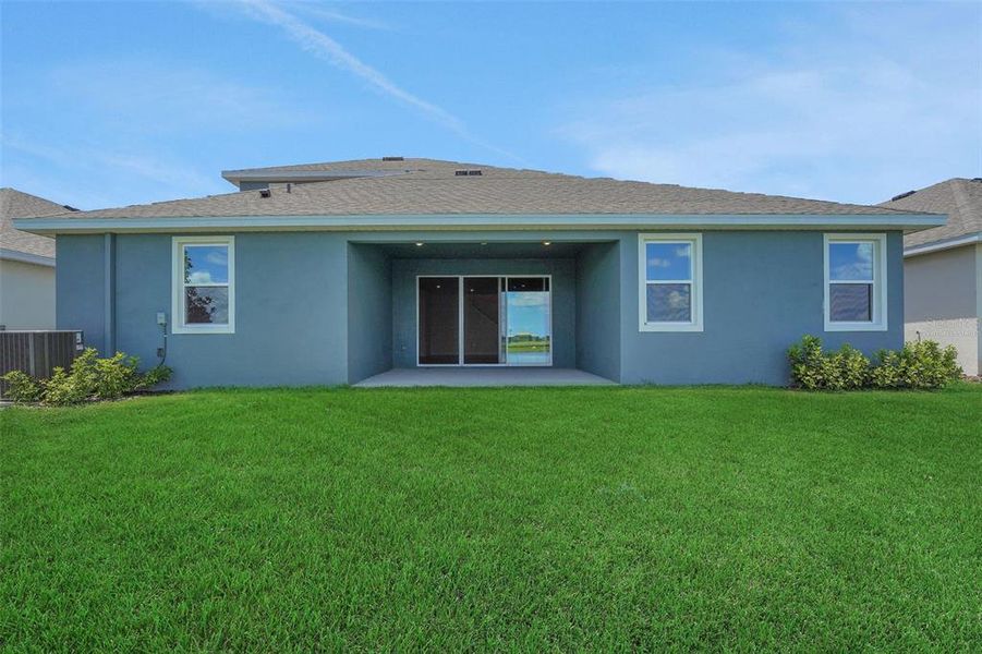 Exterior details and patio area of a home in Seaire, Parrish (Image 25).