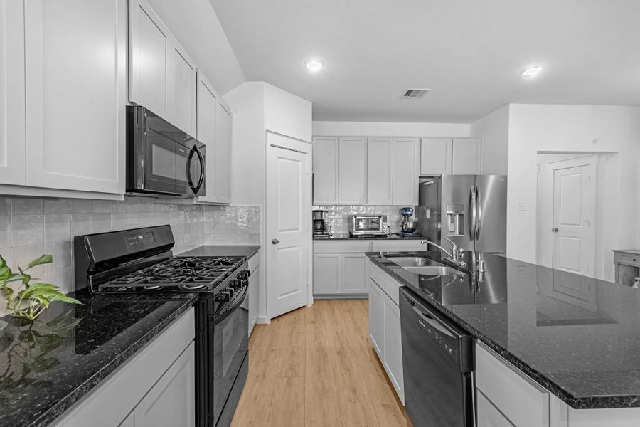 Furnished interior view inside a new home in Sunterra, Katy (Image 13).