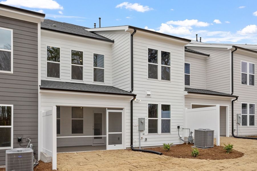 Exterior details and patio area of a home in Ovation at Sweetbrier, Durham (Image 21).