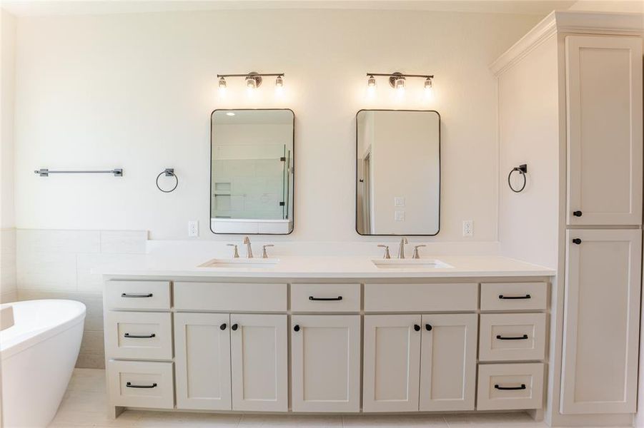 Decorative lighting, custom cabinets, linen storage, and double vanities in the primary ensuite. Decorative lighting, custom cabinets, linen storage, and double vanities in the primary ensuite.