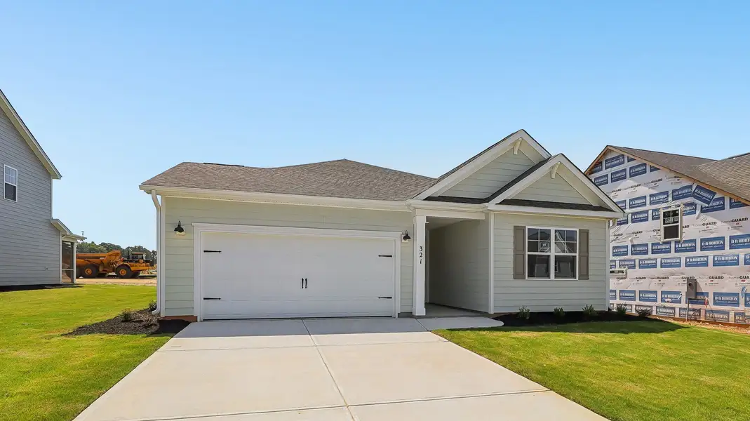 Front exterior of a new home in Shell Pointe, Gilbert, SC, highlighting curb appeal (Image 14).
