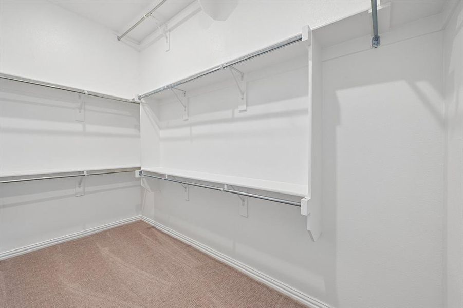 With plenty of space for two and seasonal hanging racks, this dream closet is waiting for you to fill it up! With plenty of space for two and seasonal hanging racks, this dream closet is waiting for you to fill it up!