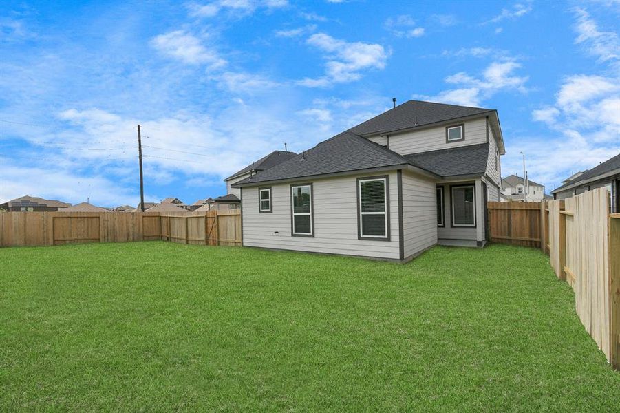 Come and see this spacious backyard with its beautiful covered patio. There is plenty of room for the kids to play and adults to relax. Perfect for your outdoor living space, patio furniture, bbq pit, and so much more. The possibilities are endless!