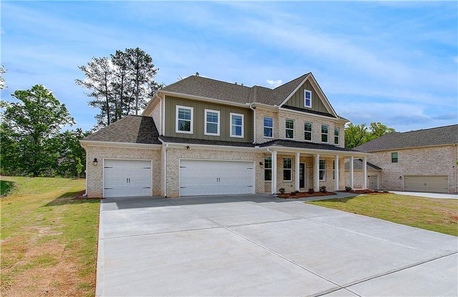 Front exterior of a new home in Cambria at Traditions, Hampton, GA, highlighting curb appeal (Image 1).