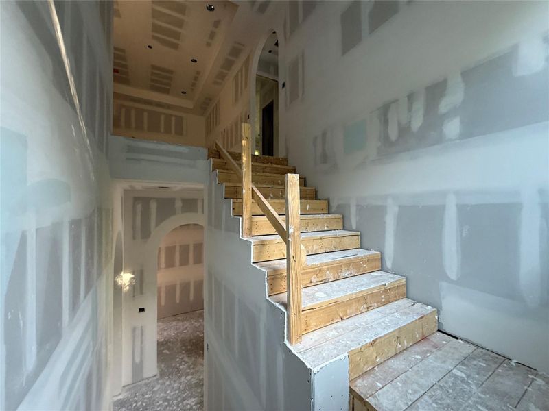 Extra wide staircase leading upstairs