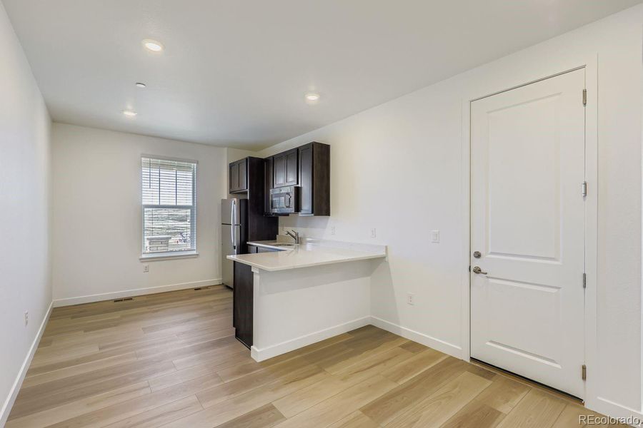 Furnished interior view inside a new home in Sunset Village: The Grand Collection, Erie (Image 7). Furnished interior view inside a new home in Sunset Village: The Grand Collection, Erie (Image 7).