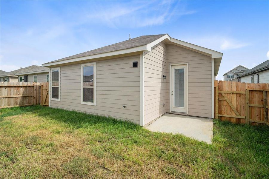 Come and see this spacious backyard with its beautiful covered patio. There is plenty of room for the kids to play and adults to relax!