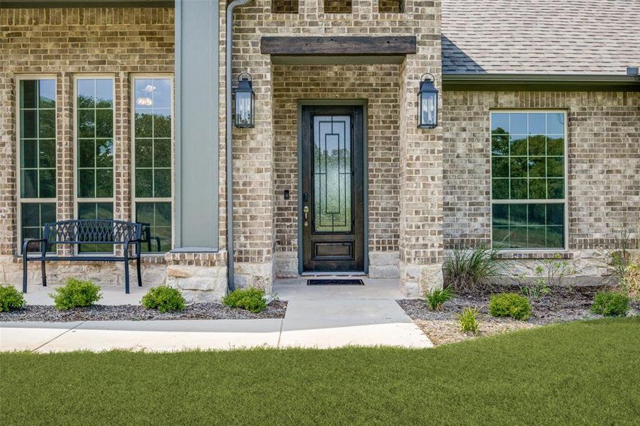 Doorway to property with a yard