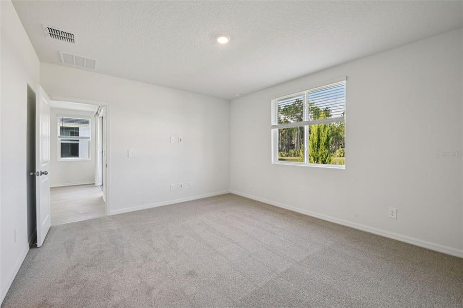 Spacious, unfurnished interior of a new home in Ridgehaven - Villas, Ormond Beach (Image 27).