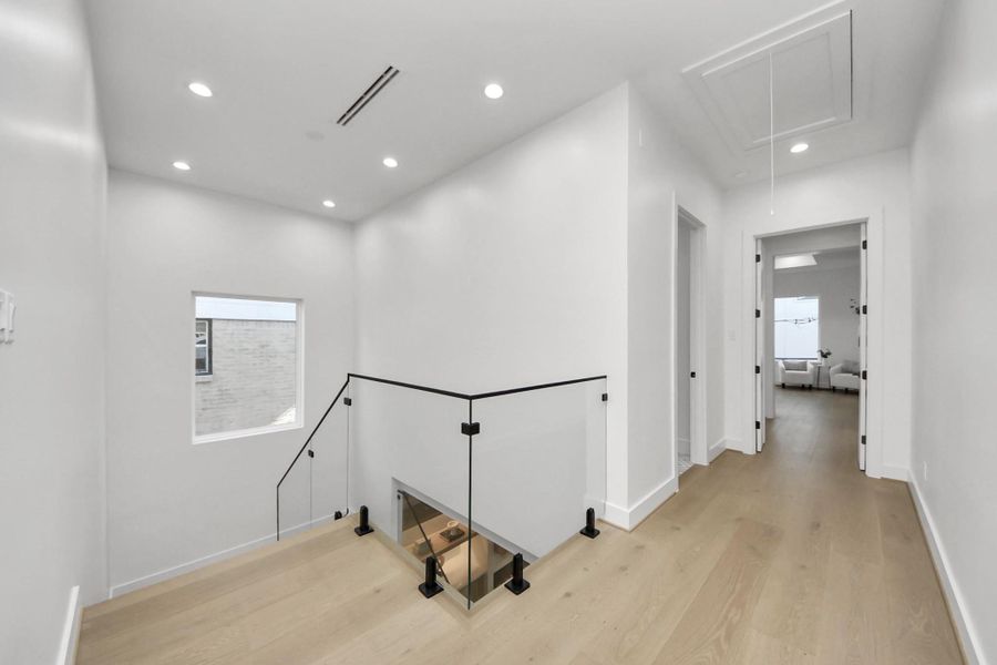 Modern glass railing along the staircase.