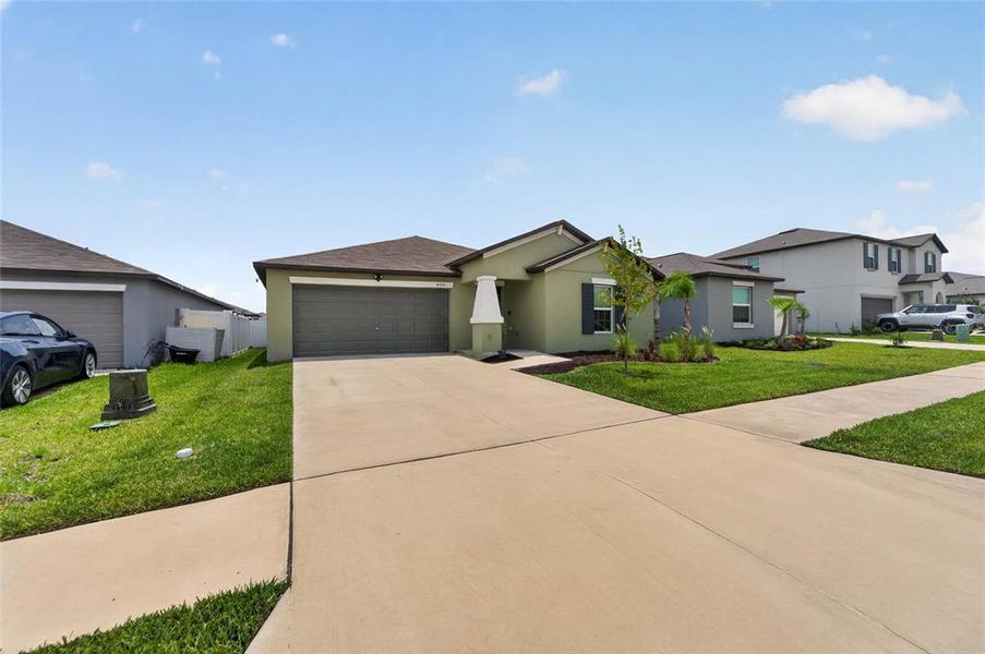 Front exterior of a new home in , Bartow, FL, highlighting curb appeal (Image 24).