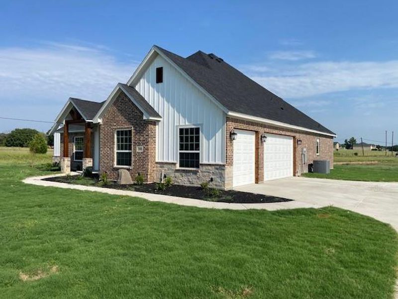 Front exterior of a new home in , Reno, TX, highlighting curb appeal (Image 1).