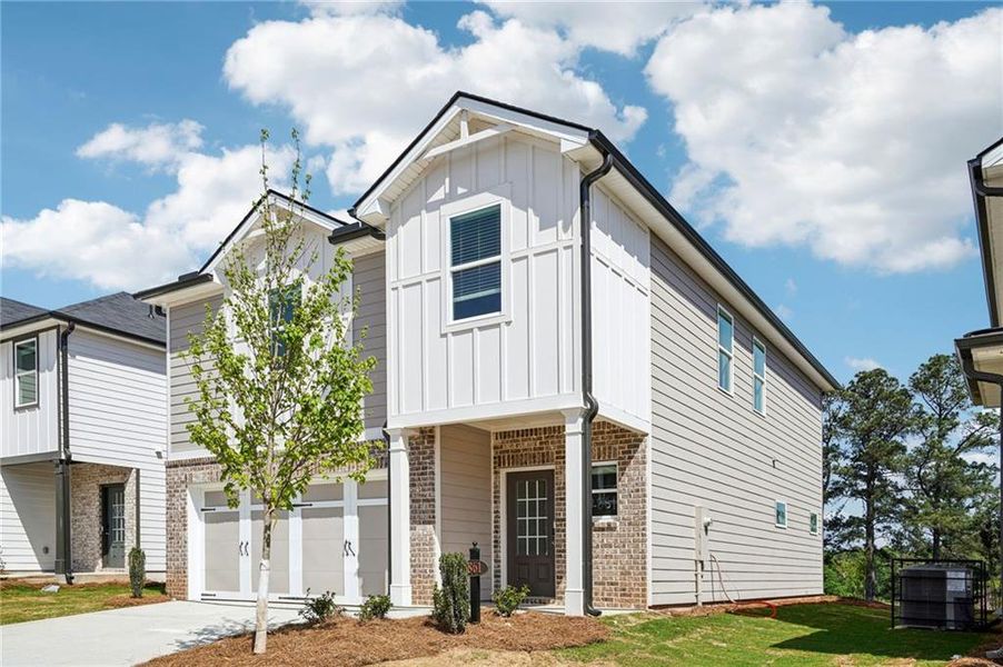 Front exterior of a new home in Hawthorne Station, College Park, GA, highlighting curb appeal (Image 25). Front exterior of a new home in Hawthorne Station, College Park, GA, highlighting curb appeal (Image 25).