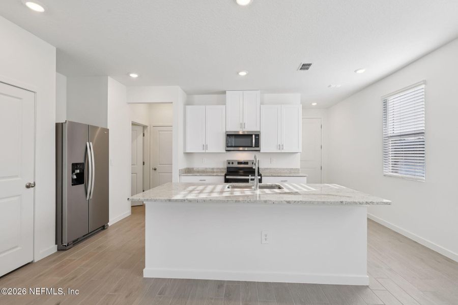 Furnished interior view inside a new home in Cypress Meadows - The Villas, Jacksonville (Image 3).