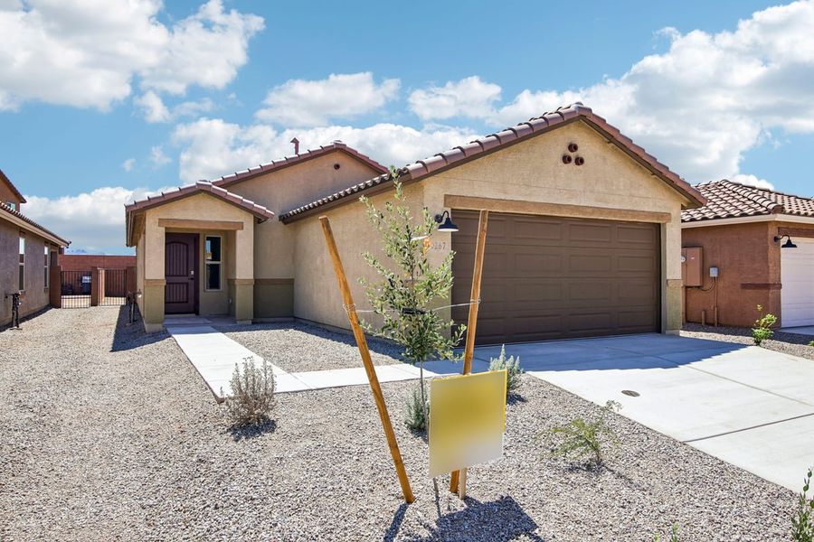 Front exterior of a new home in Mandarina Reserve, Marana, AZ, highlighting curb appeal (Image 1). Front exterior of a new home in Mandarina Reserve, Marana, AZ, highlighting curb appeal (Image 1).